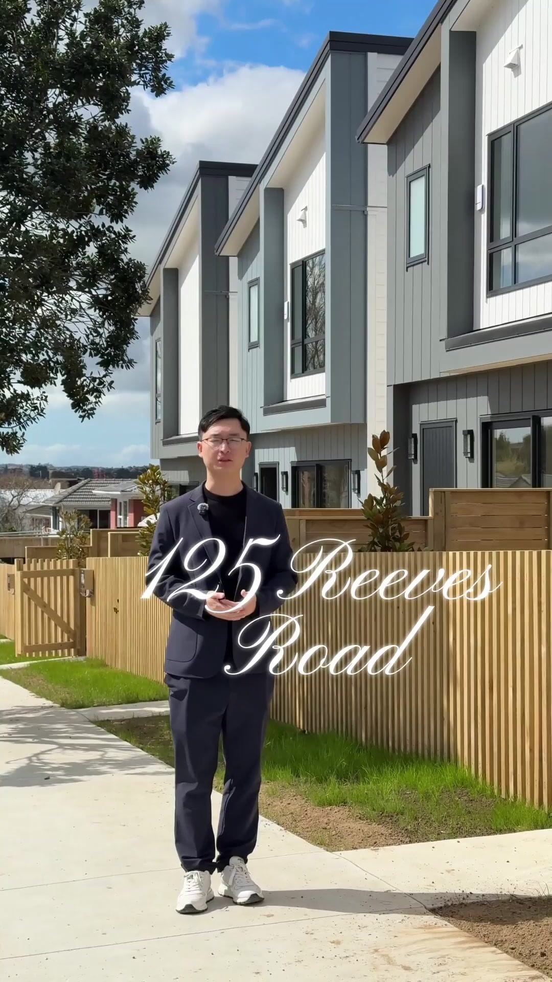 Justin Shen standing outside the new homes, with the title 125 Reeves Road