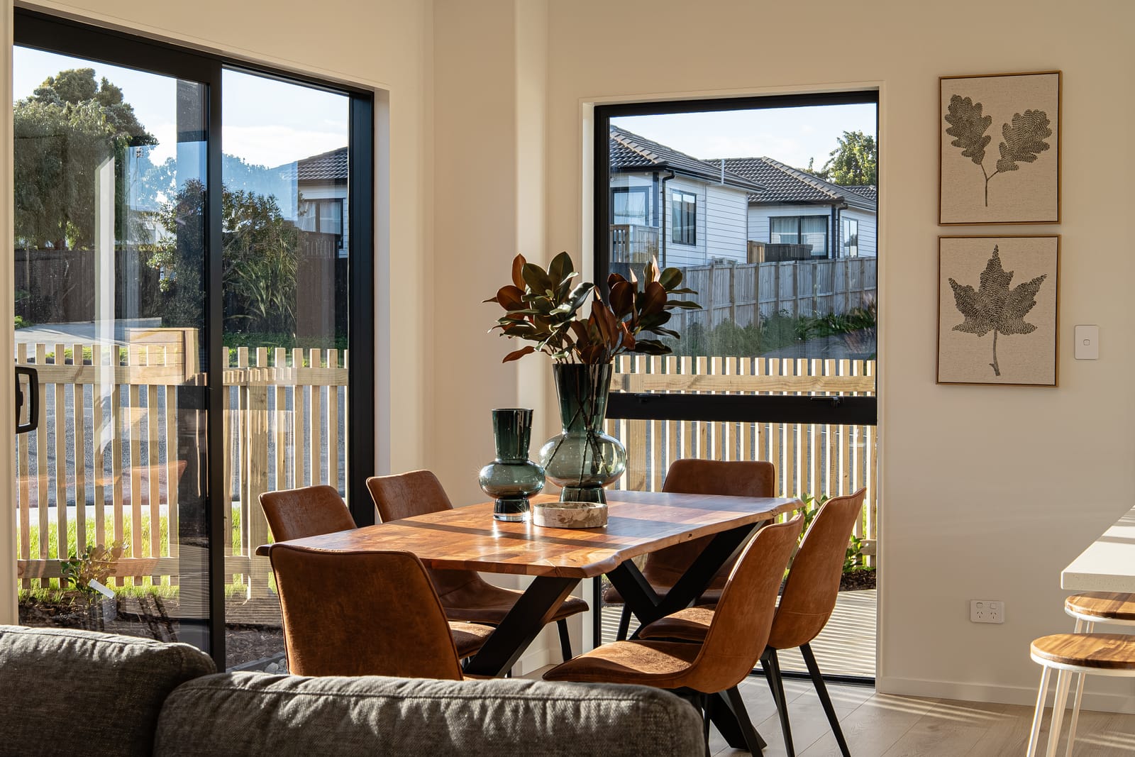 Dining table beside sliding doors that open to the garden